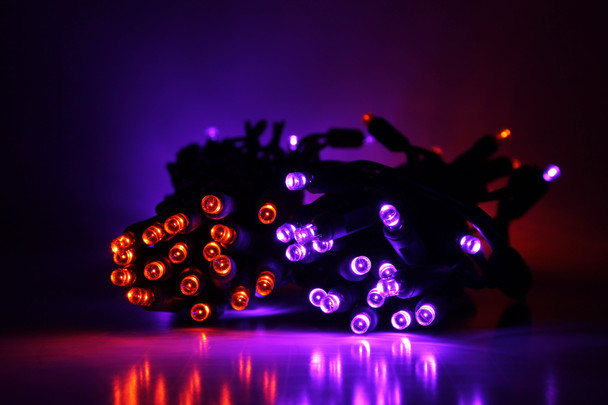 Outdoor LED Lighted Christmas Tree with Green Base and Orange and Purple Tree Lights