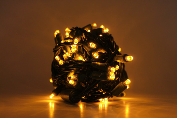 Outdoor LED Lighted Christmas Tree with Green Base and Orange and Purple Tree Lights