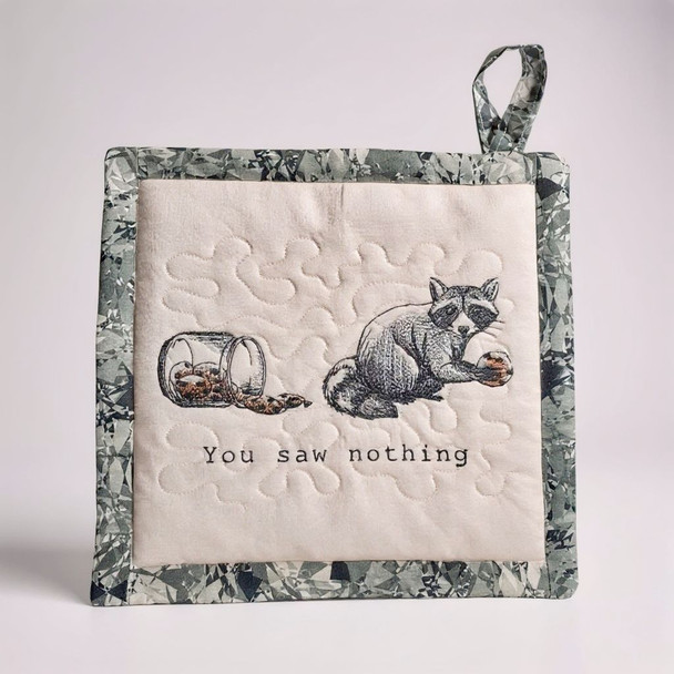 Our newly designed Sneaky Racoon Potholder/Hot Pad features a racoon sneaking a cookie out of the cookie jar with the saying, "You Saw Nothing!" Order at Harvest Array online.