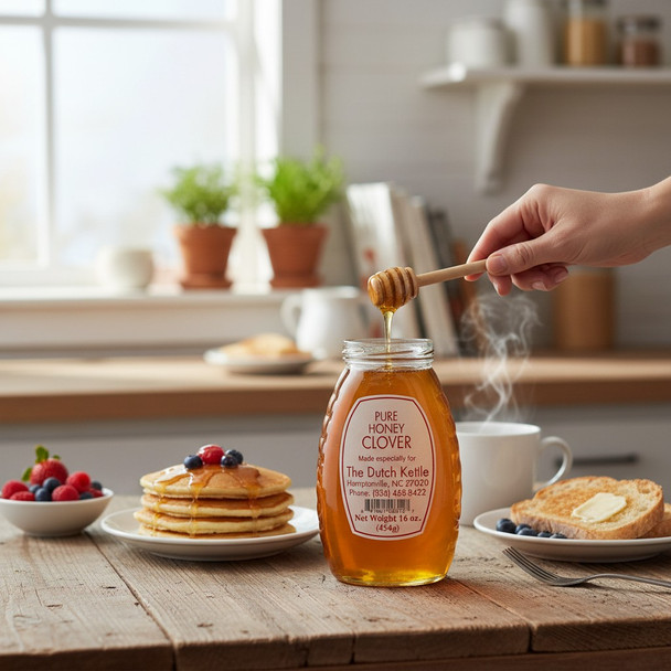 Pure clover honey jar with honey dipper drizzling over breakfast pancakes and toast