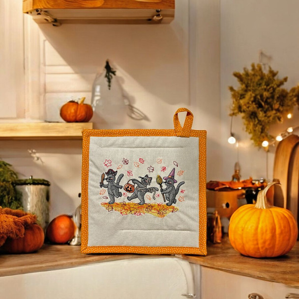 Our Halloween Dress Up Cats Potholder will look great in your kitchen amongst other not-so-spooky Halloween decor. It's Reversible too.  Purchase online at harvestarray.com.