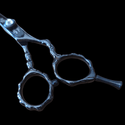 Shear Fanatic™️ Scissor Black Bamboo Floral Professional Hair Cutting Shears, close-up of the stainless steel scissors with black bamboo floral design and ergonomic finger rings against a black background.