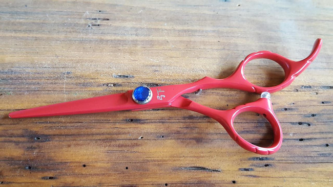 Shear Fanatic™️ Scissor Shear Fanatic Pro Series Red Hair Cutting Shears, professional hairdressing scissors with ergonomic handles on a wooden surface.