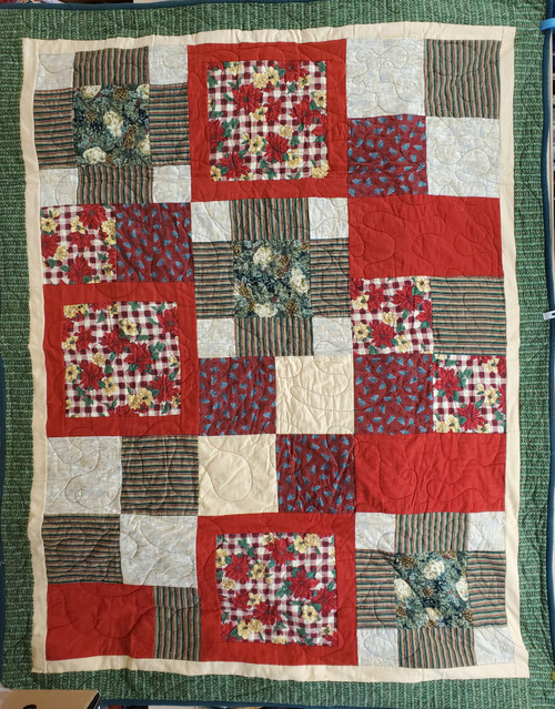 View of the front of this warm and cozy Christmas quilt