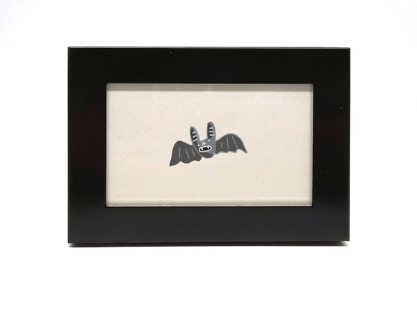 Bat Print by Elisa Wikey. Framed paper print. This flappy friend is ready to flutter their way into your heart or under your nearest bridge or belfry. We’re batty about it!