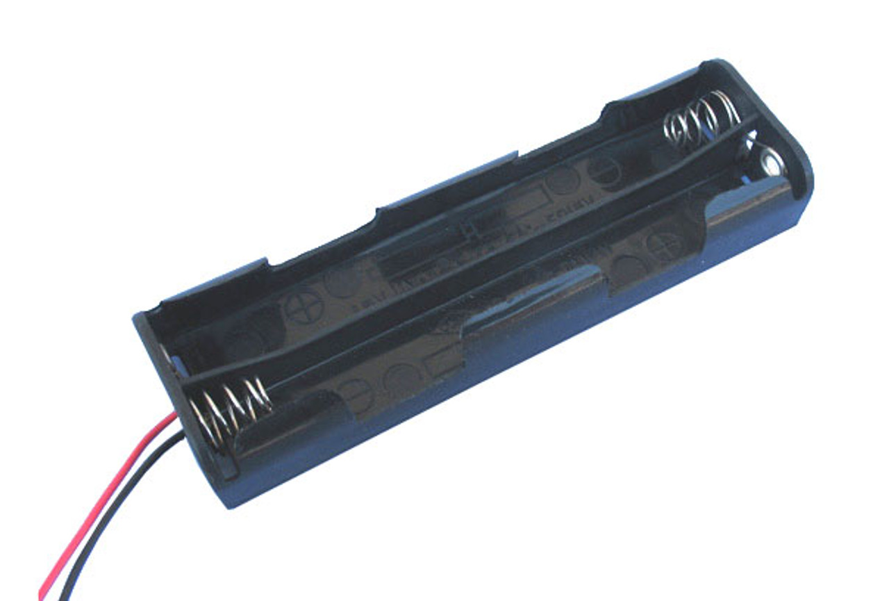Battery holder accepting 4 AA size batteries providing 6 volts output with connection wires