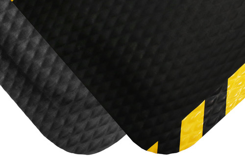 Corner of Black Hog Heaven mat with another black Hog Heaven mat with yellow border on top. Both mats have slanted edges and are thicker in the center and have a diamond patterned surface. Corner of Black Hog Heaven mat with another black Hog Heaven mat with yellow border on top. Both mats have slanted edges and are thicker in the center and have a diamond patterned surface.