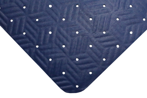 Corner of blue Wet Step mat. Corner is rounded and mat is thin with a soft textured surface with small holes throughout.