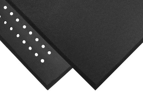 Corner of black Cushion Complete rubber mat with beveled edging sitting on top of another Complete Comfort Mat which has drainage holes in it. Corner of black Cushion Complete rubber mat with beveled edging sitting on top of another Complete Comfort Mat which has drainage holes in it.