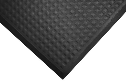Corner of black Comfort Premier Mats. Mat looks thick with some texture across the top and beveled edging.