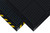 Corner of black Hog Heaven workstation mat sitting on top of black with yellow border mat. Both mats have a grid like texture on top. Corner of black Hog Heaven workstation mat sitting on top of black with yellow border mat. Both mats have a grid like texture on top.