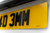Angled close-up of 4D 3mm rear number plate showing perfectly cut black lettering