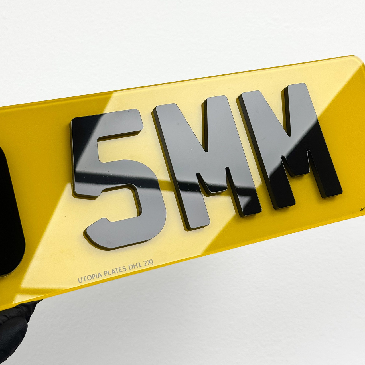 Close-up of 5mm 4D number plate lettering, showing the thick raised acrylic letters