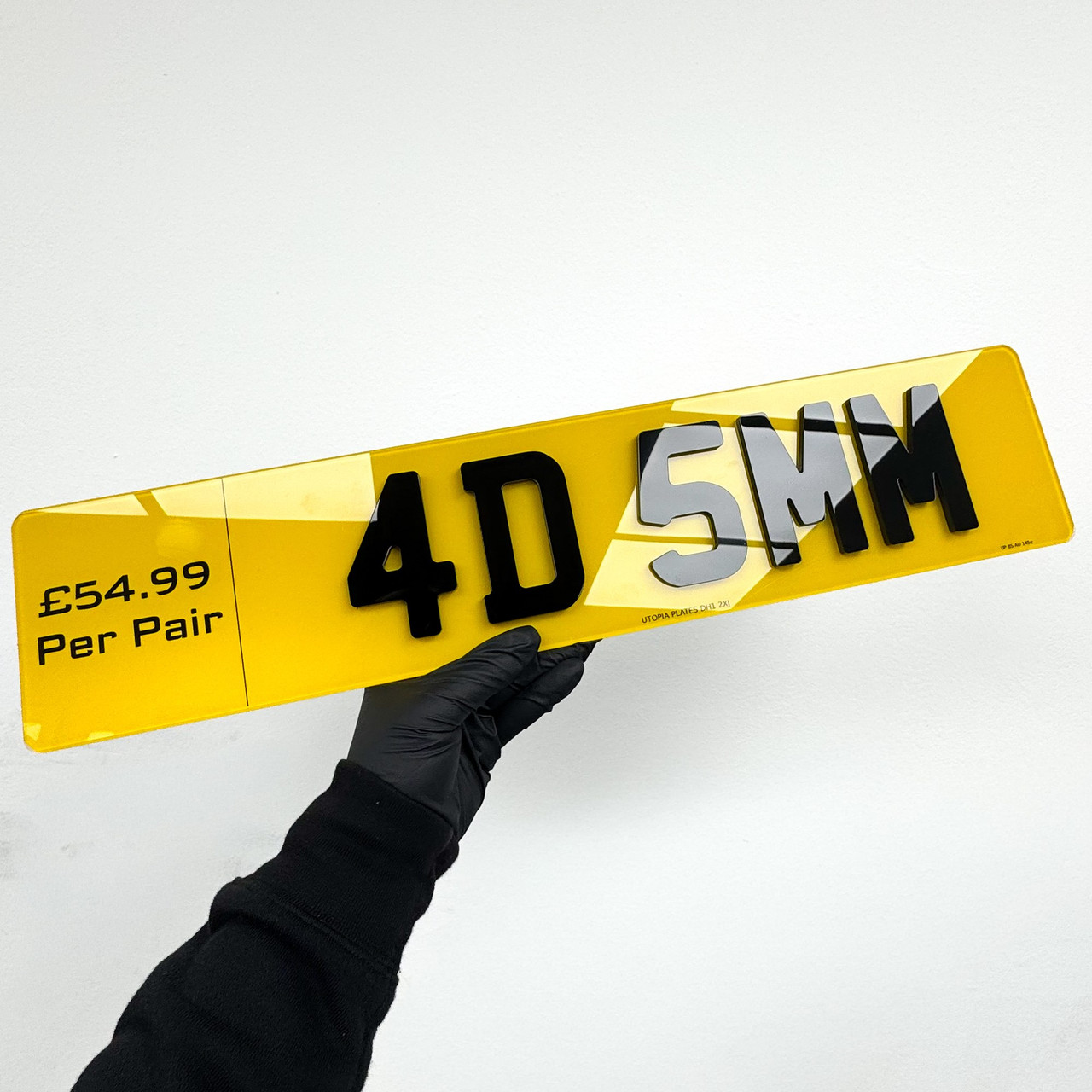 4D 5mm number plate held at an angle, showing the extra depth of the 5mm acrylic characters