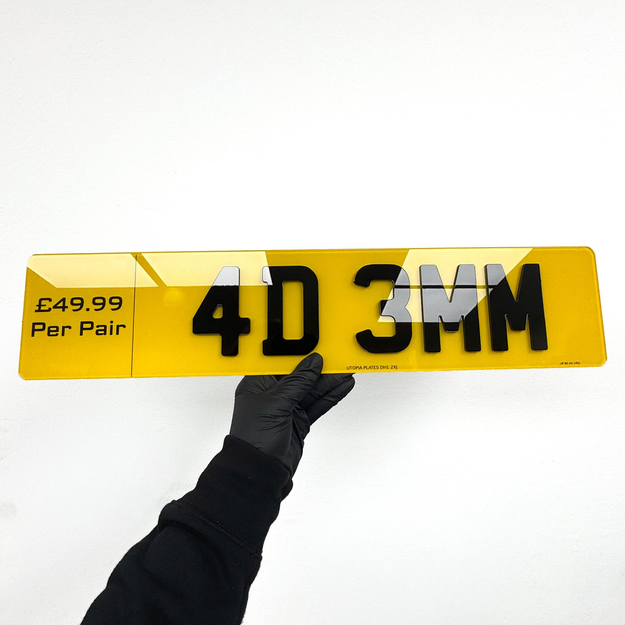 4D 3mm number plate held at an angle, showing the depth of the raised acrylic characters