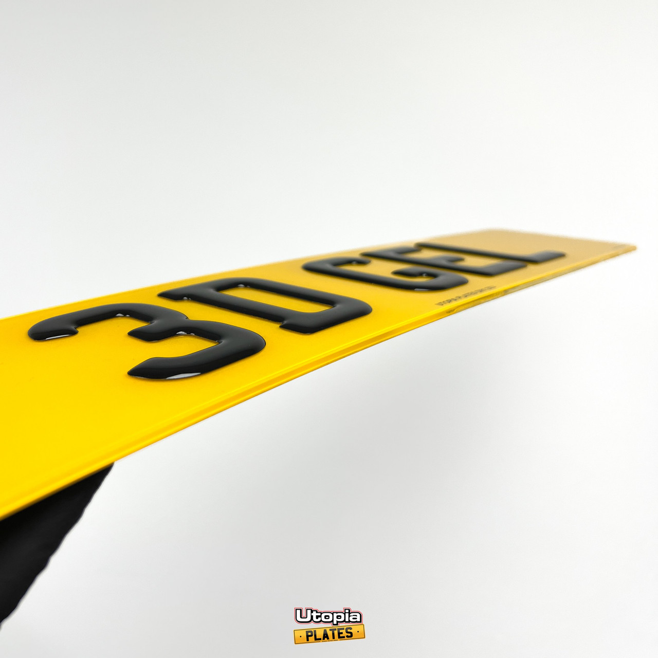 Zoomed-in perspective of 3D gel number plates revealing the intricacies and craftsmanship