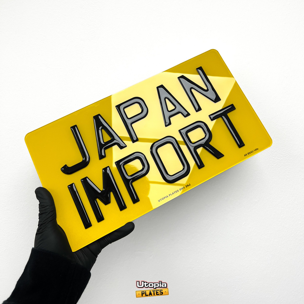 Japanese import size rear number plate with the words JAPAN IMPORT on it in 3D gel resin lettering