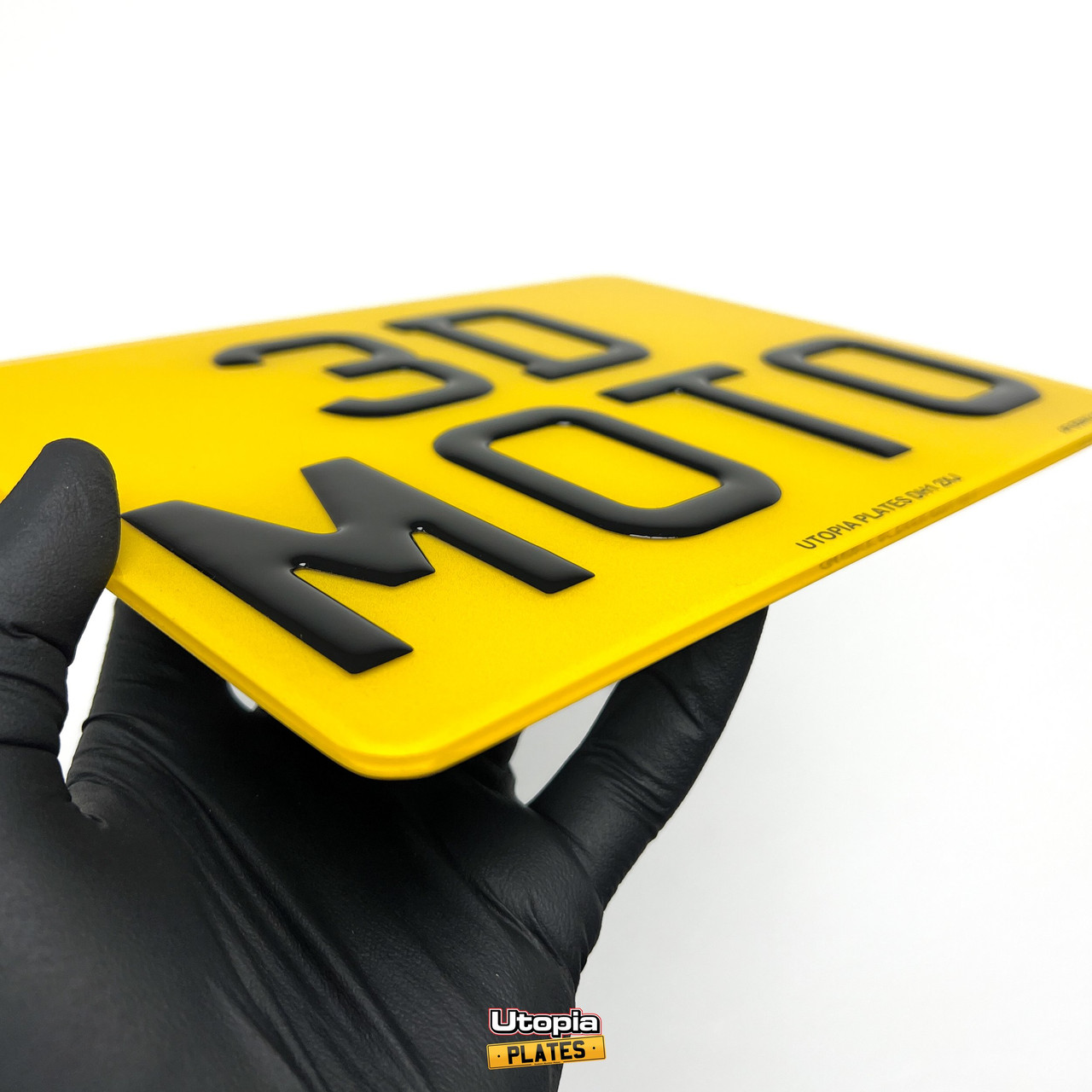 Side-on view of a rear motorbike number plate with 3D Gel resin lettering