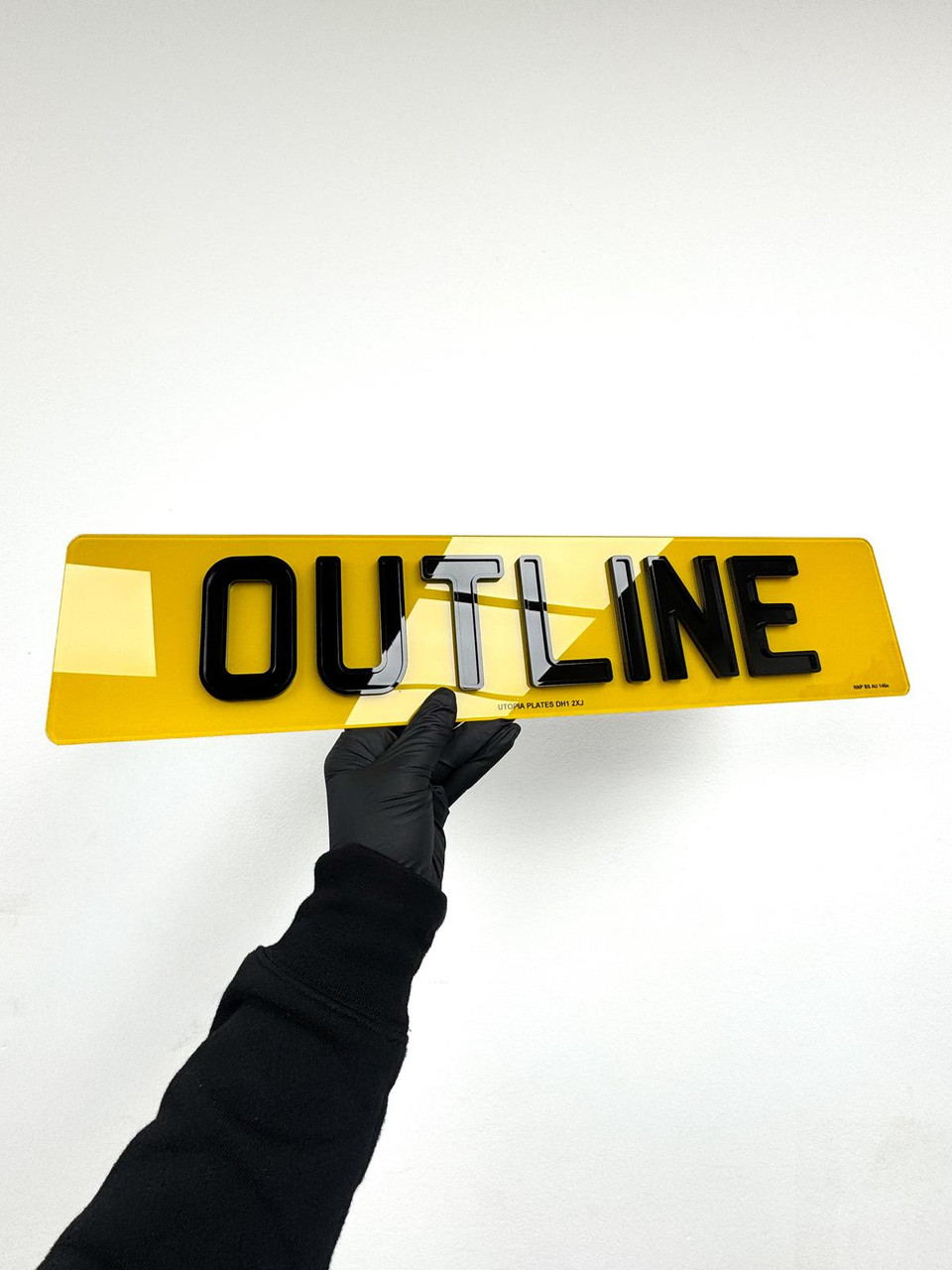 Angled view of an Outline 4D number plate showing the raised depth of the 3mm acrylic characters and outline layer