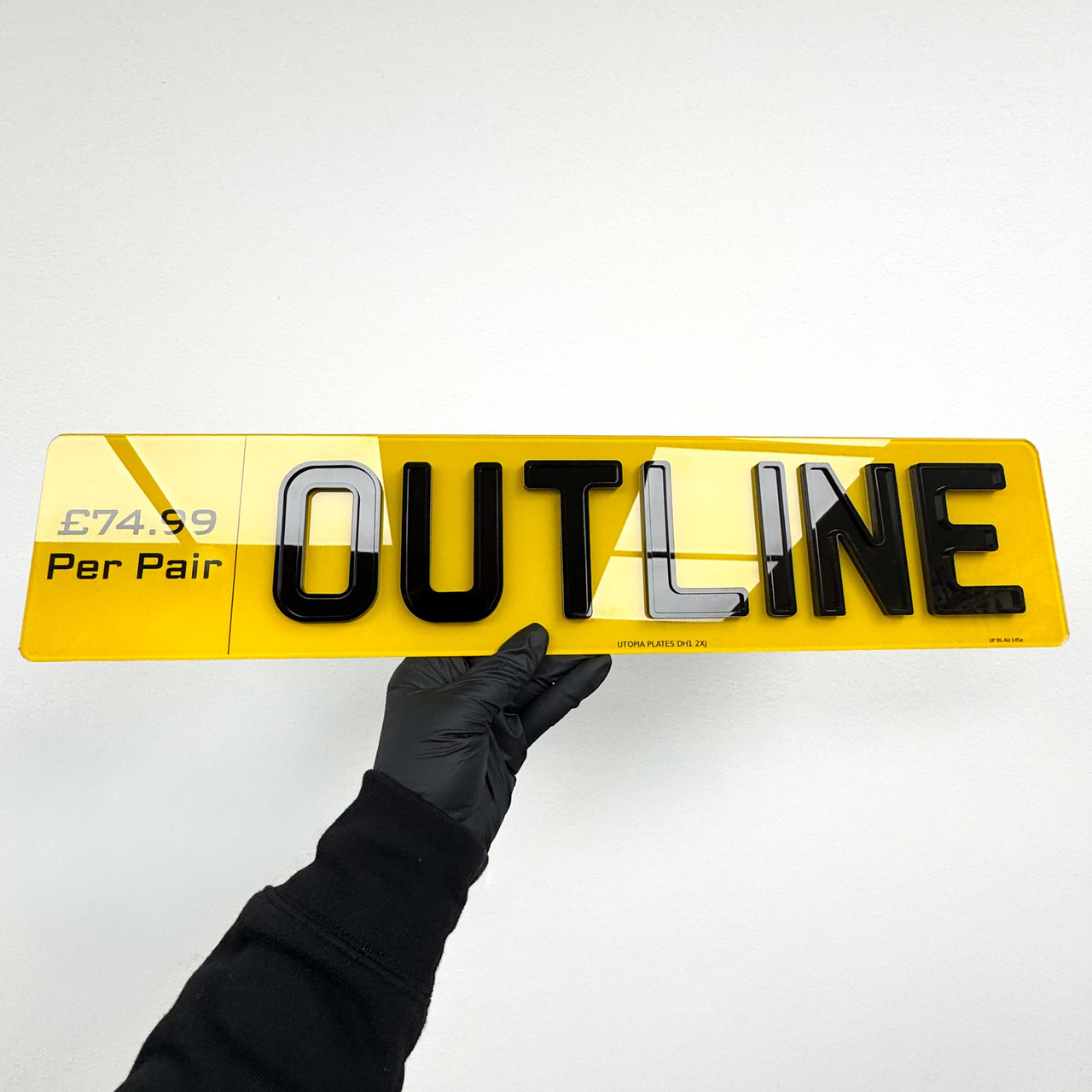 Yellow rear 3D gel number plate shown face on, with glossy domed black characters