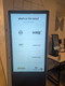 Interactive 55-inch 500nit touchscreen digital poster kiosk showing a restaurant menu icon selection screen.