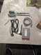 Unboxed components of the WAND Gateway: Ethernet to Wi-Fi Adapter, including antennas, Ethernet cable, and power supply.