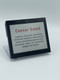 A digital smart label on a stand displaying a Caesar salad menu description.