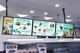 Professional multi-screen digital menu board installation in a quick-service restaurant. This setup uses zero-gap display technology to provide a seamless, high-definition customer ordering experience.