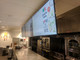 An angled perspective of a multi-screen digital menu system, highlighting the zero-gap installation capability that provides a clean, continuous viewing experience.