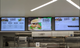 A triple-screen digital menu board installation featuring professional displays, designed for seamless content synchronization and improved visual clarity in quick-service restaurants.