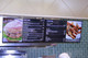 A dual-screen digital menu board installation featuring professional displays, optimized for quick-service restaurants to effectively present menu items, pricing, and point-of-sale options.