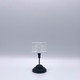 A 3 inch black metal elegant smart label ESL holder featuring a sturdy base and clear display holder against a light background.