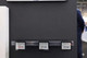 Retail shelf installation featuring three WAND 6.1" electronic smart labels mounted on a clear tracking rail to demonstrate multi-unit wireless price tag automation.