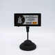 A product information display featuring Emmy's Organics cookies on a black stand.