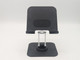 A close-up of a black, adjustable tablet stand featuring a stable base and support ledge.