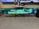 The 86 inch Ultra Stretch LG smart screen displaying Welcome to Campus Eagles, demonstrating high-brightness 500nit performance.