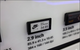 A 2.9-inch digital smart label displaying Nike Air slide pricing on a store display unit.