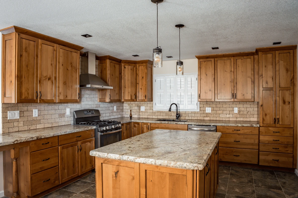 Kitchen with natural wood cabinetry and central island