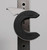 Eleiko Oppen Barbell Collars with the collar clamped closed around a vertical barbell sleeve