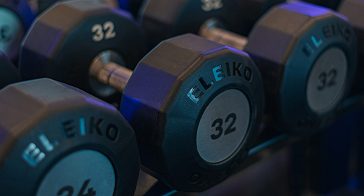 Eleiko Evo dumbbells on a storage rack