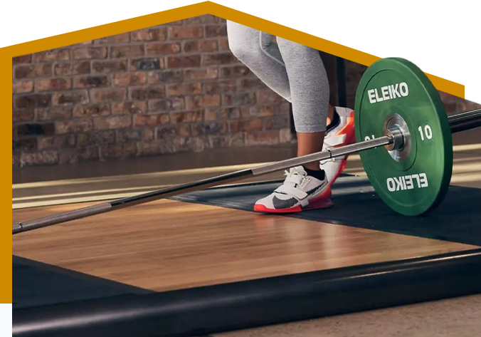 Cross-section detail of an Eleiko SVR platform showing multi-layer dampening and drop-zone rubber
