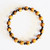 Fair trade carved olive wood and hematite stretch bead bracelet from West Bank, Palestine