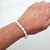 Fair trade carved mother of pearl bead stretch bracelet from West Bank, Palestine