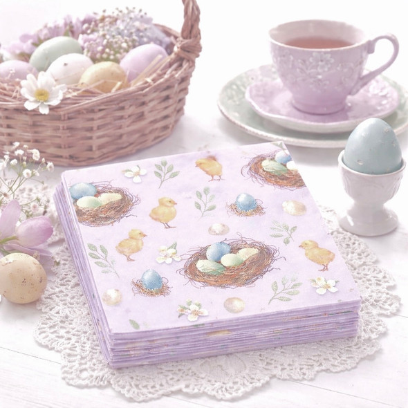 Easter chicks and colourful eggs paper napkins on pastel spring background