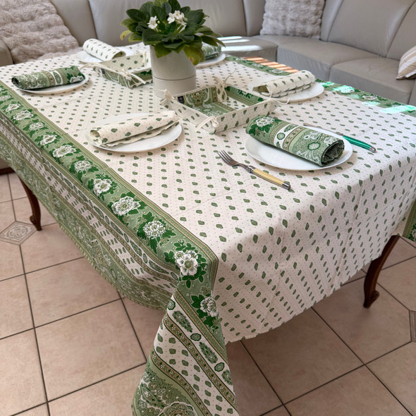 200 x 150 cm rectangular stain-resistant coated French tablecloth in Bastide Green design with green floral and paisley patterns, matching French napkins and bread basket, made in France