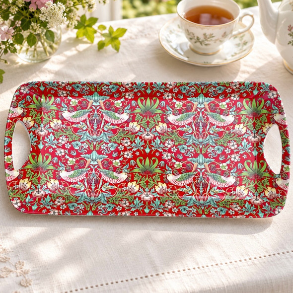 Red William Morris Strawberry Thief melamine sandwich tray with finger sandwiches in a British afternoon tea setting