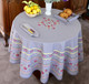 150 cm round French tablecloth in Avignon Grey with small fuchsia flowers – stain-resistant coated cotton – made in France – matching napkins and bread basket available