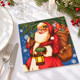 Santa Claus Christmas paper napkins featuring Father Christmas holding a glowing lantern and sack of presents against a blue snowy background, 33x33cm