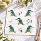 Australian Kingfisher 3-ply paper napkins featuring five colourful turquoise blue and green kingfishers perched on branches with delicate botanical details against a white background, 33x33cm
