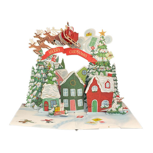 3D Super Pop Up Christmas Card: Santa in Sleigh Flying Over Snow Covered Homes: Merry Christmas